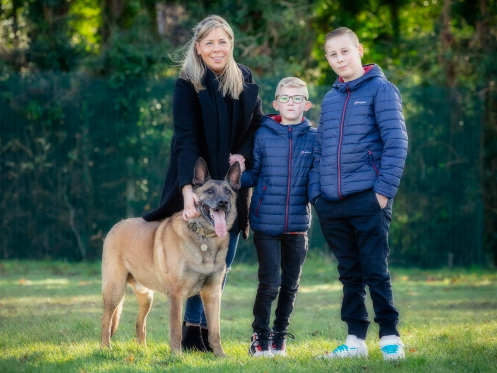 Retired police dog Tai with his family