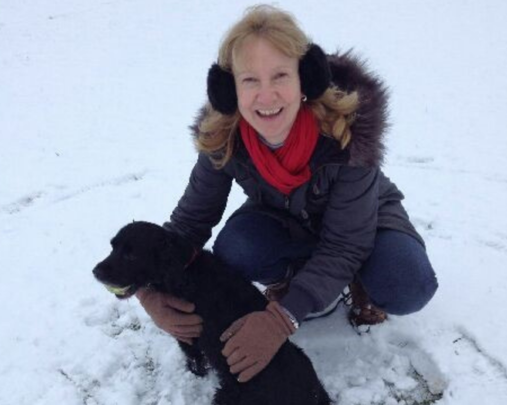 Retired police dog Milly with her owner, Judith