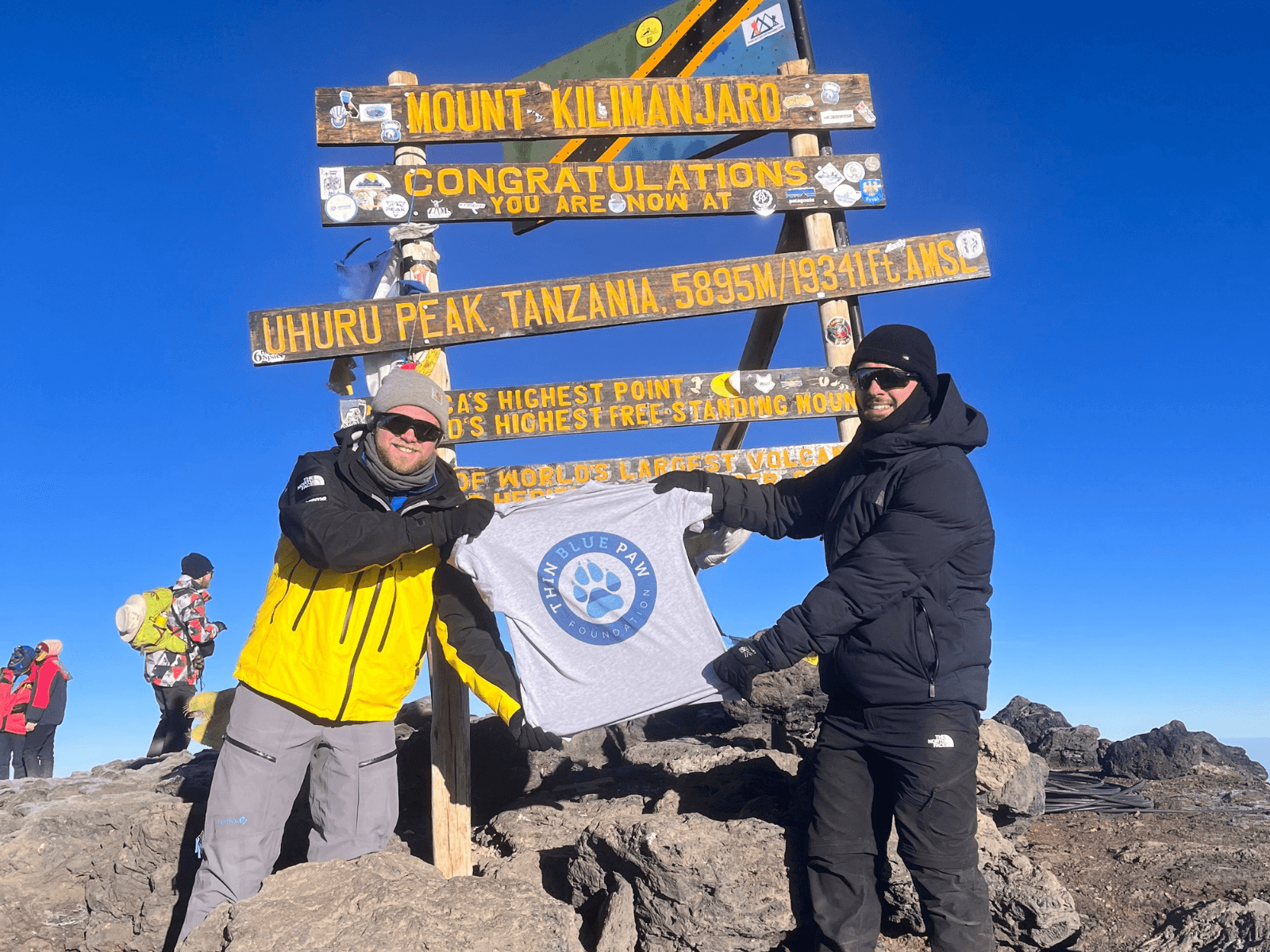 Ethan and Max at the top of Mount Kilimanjaro, Tanzania, which they climbed to raise money for the Foundation