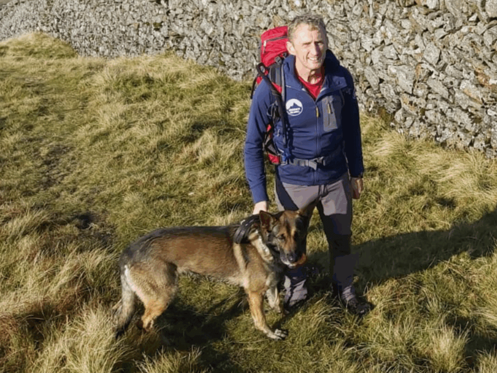 Retired police dog Chas enjoying a hike with Nigel