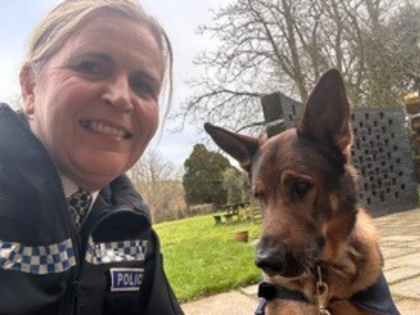 Trustee Diane Lewis with a police dog