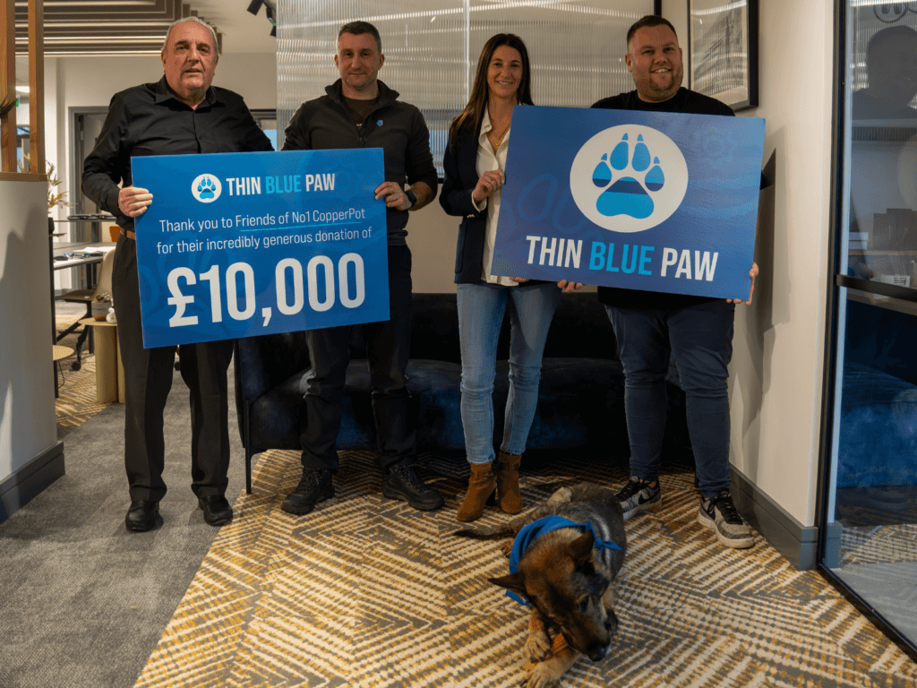 No 1 CopperPot representatives present a £10,000 cheque to the Thin Blue Paw Foundation