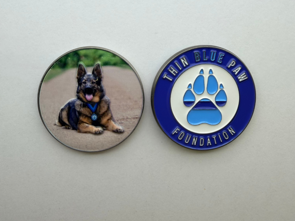 Challenge coins featured RPD Luna and the Thin Blue Paw Foundation logo