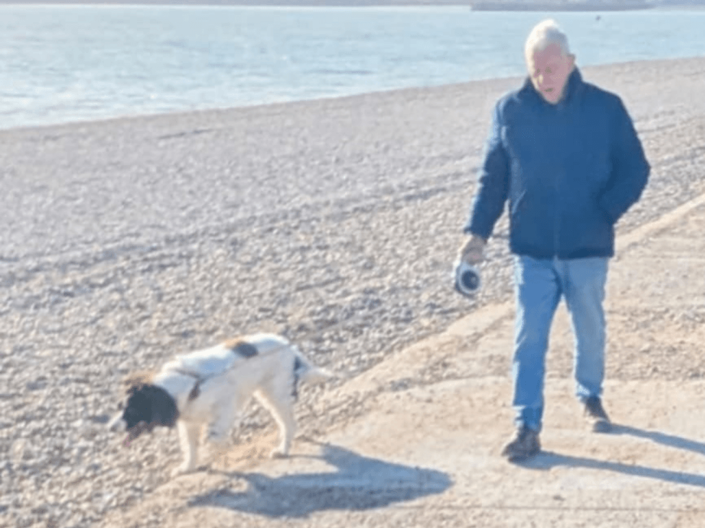 Red and John walking along the beach