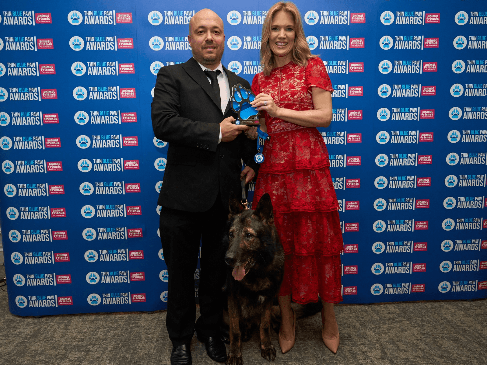 Marcus and RPD Captain collect their Lifetime Achievement Award
